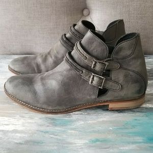 Grey leather ankle boots with buckle detail